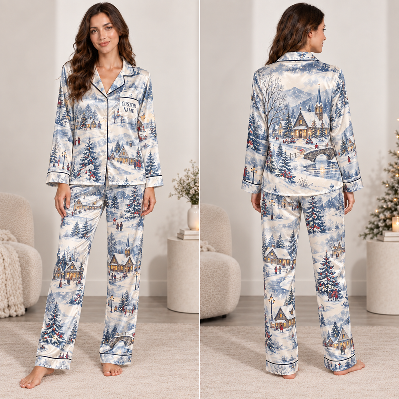 woman wearing a winter village christmas satin pajama set with snow-covered houses