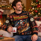 man in a back to the christmas ugly christmas sweater holding a