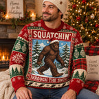 man wearing a bigfoot ugly christmas sweater with squatchin through the snow