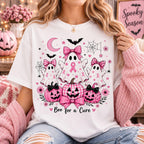 woman wearing a pink and black boo for a cure breast cancer