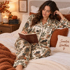 woman in bedroom with a mug wearing the boo-oooooks halloween satin pajama
