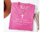 pink graphic tee with cross and this is how I fight my