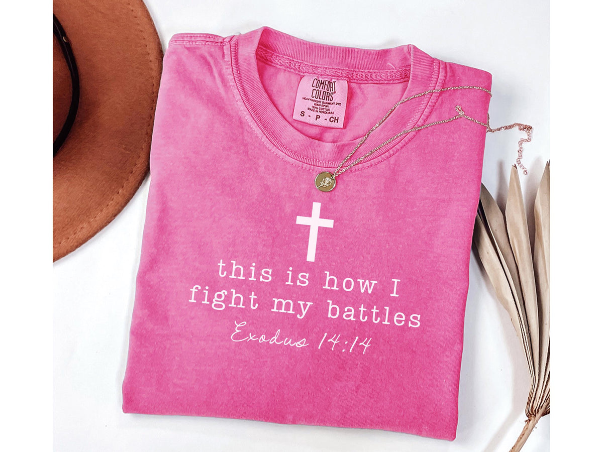 pink graphic tee with cross and this is how I fight my