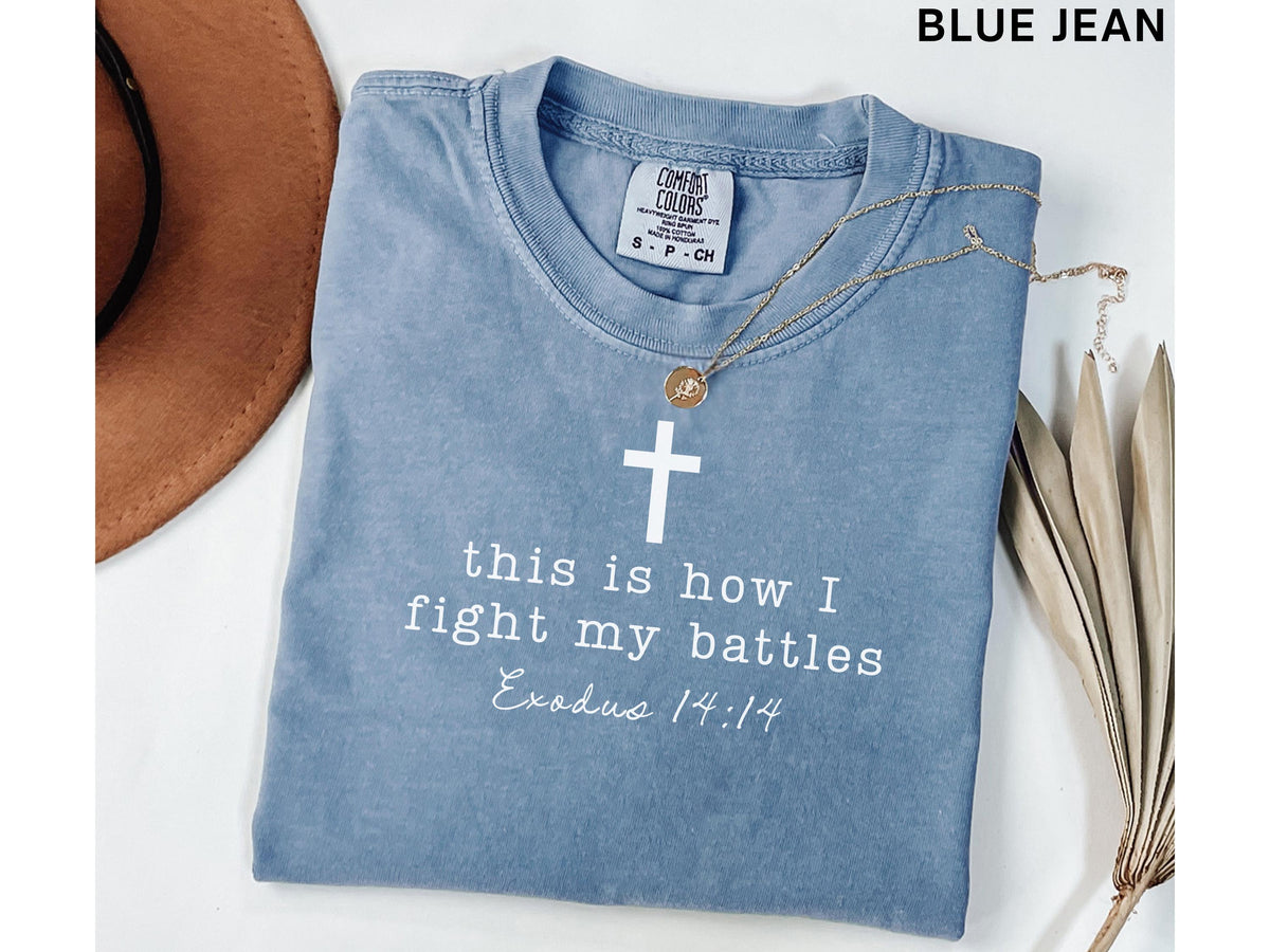 blue jean graphic tee with cross and Exodus 14:14 scripture design