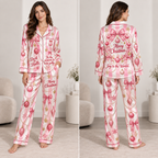 woman in pink satin pyjamas with breast cancer ribbon and christmas ornament