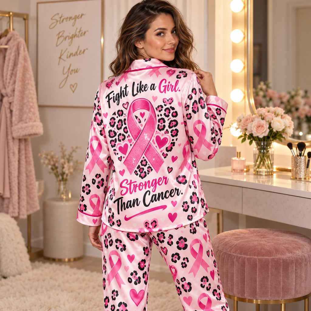 woman holding mug in pink ribbon awareness satin loungewear pyjamas