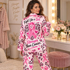woman holding mug in pink ribbon awareness satin loungewear pyjamas