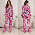 woman modeling a pink leopard breast cancer awareness satin pajama set