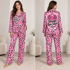 woman modeling a pink leopard breast cancer awareness satin pajama set