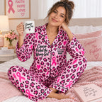 woman in pink leopard satin pajamas holding a brighter mug
