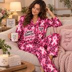 lifestyle flat lay of pink ribbon satin pajamas with name pocket detail