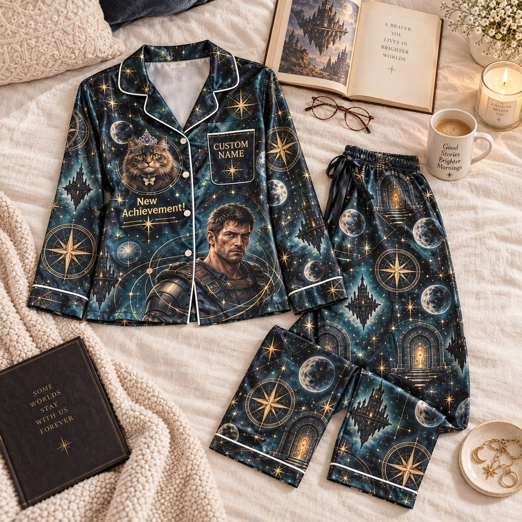 dark teal galaxy satin pajamas flat lay with a custom name on the chest