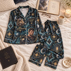 dark teal galaxy satin pajamas flat lay with a custom name on the chest