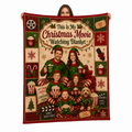family in elf pajamas christmas movie watching blanket held up against