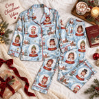 flat lay of light blue satin pajamas printed with kids in snow globes