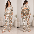 woman wearing a fall-themed satin pajama set with a coffee and ghost