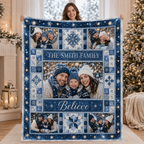 personalized family name photo blanket held up against christmas trees