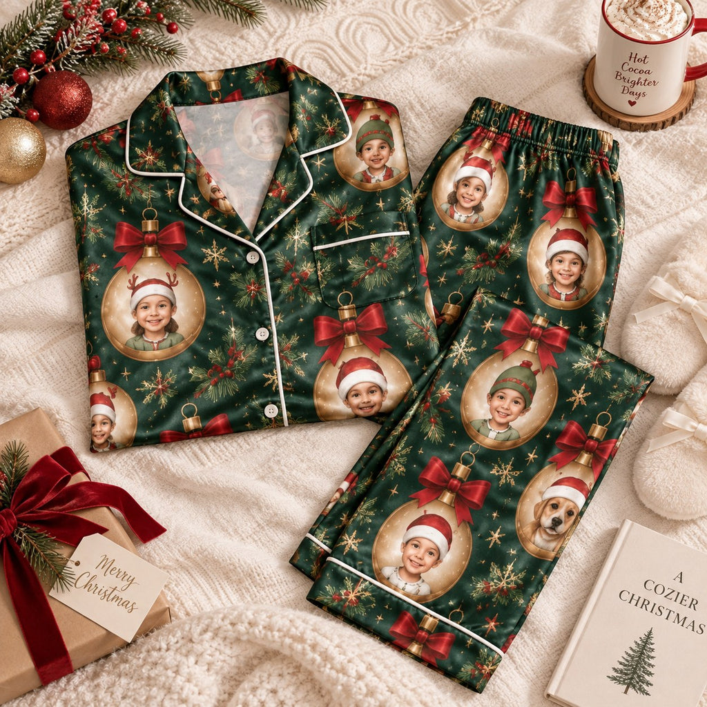 green satin pajamas flat lay with red bows and face photo ornaments