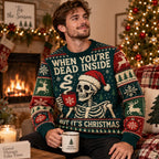 man laughing in a dark green skeleton ugly christmas sweater with hot