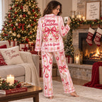model standing in a pink candy stripe satin christmas pajama set in