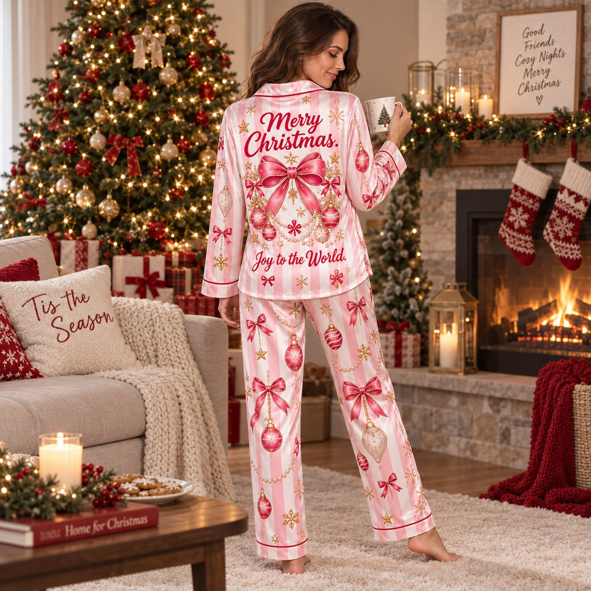 model standing in a pink candy stripe satin christmas pajama set in