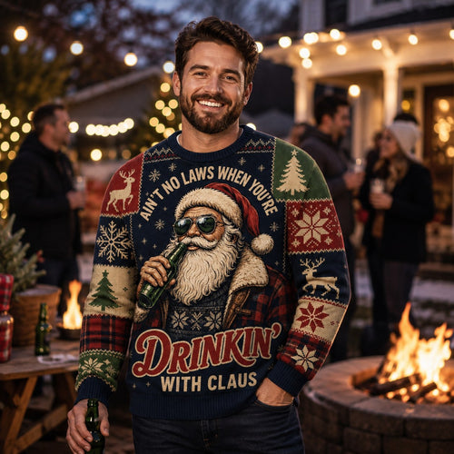 smiling man in a funny drinkin with claus christmas sweater at an