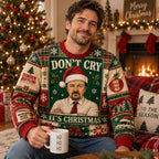 man in ugly christmas sweater with dwight schrute santa hat print holding