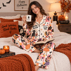 halloween satin pajamas in a decorated living room holding a Good Witch
