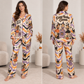 model wearing a multicolor halloween satin pajama set with witch and pumpkin
