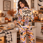 woman standing in a living room in a spooky season halloween satin
