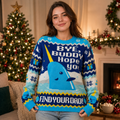 woman wearing a blue elf ugly christmas sweater with narwhal and quote