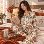 model wearing coffee themed fall pajamas in cozy living room