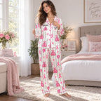 back view of satin pajamas showing pink boxing gloves shield and quote