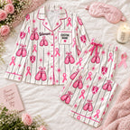 flat lay pink boxing glove satin pajamas with a custom name on the chest