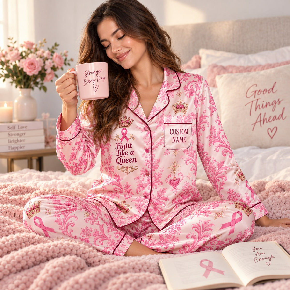 close-up of pink satin pajama shirt with Fight Like a Queen print