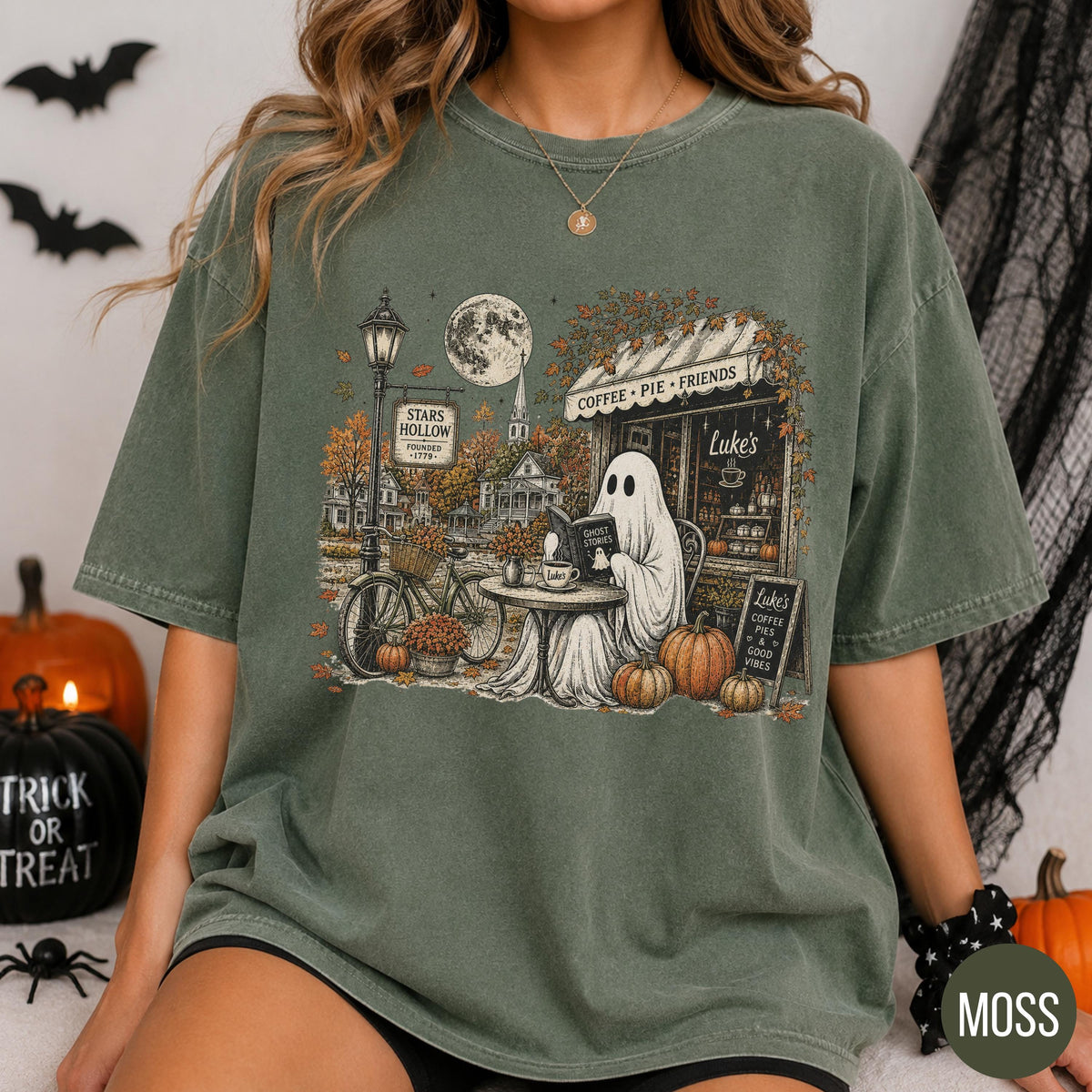 moss green graphic tee featuring ghost and pumpkin scene