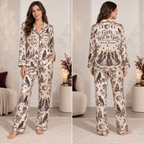 front view of cream and plum satin pajama set with witchy women