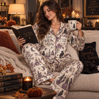 model holding personalized mug in matching witchy woman halloween satin pajama set