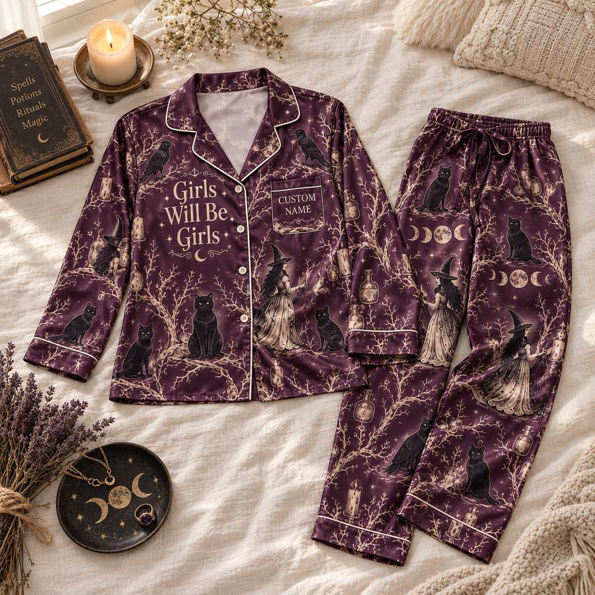 flat lay plum black cat satin pajamas with a custom name on the chest