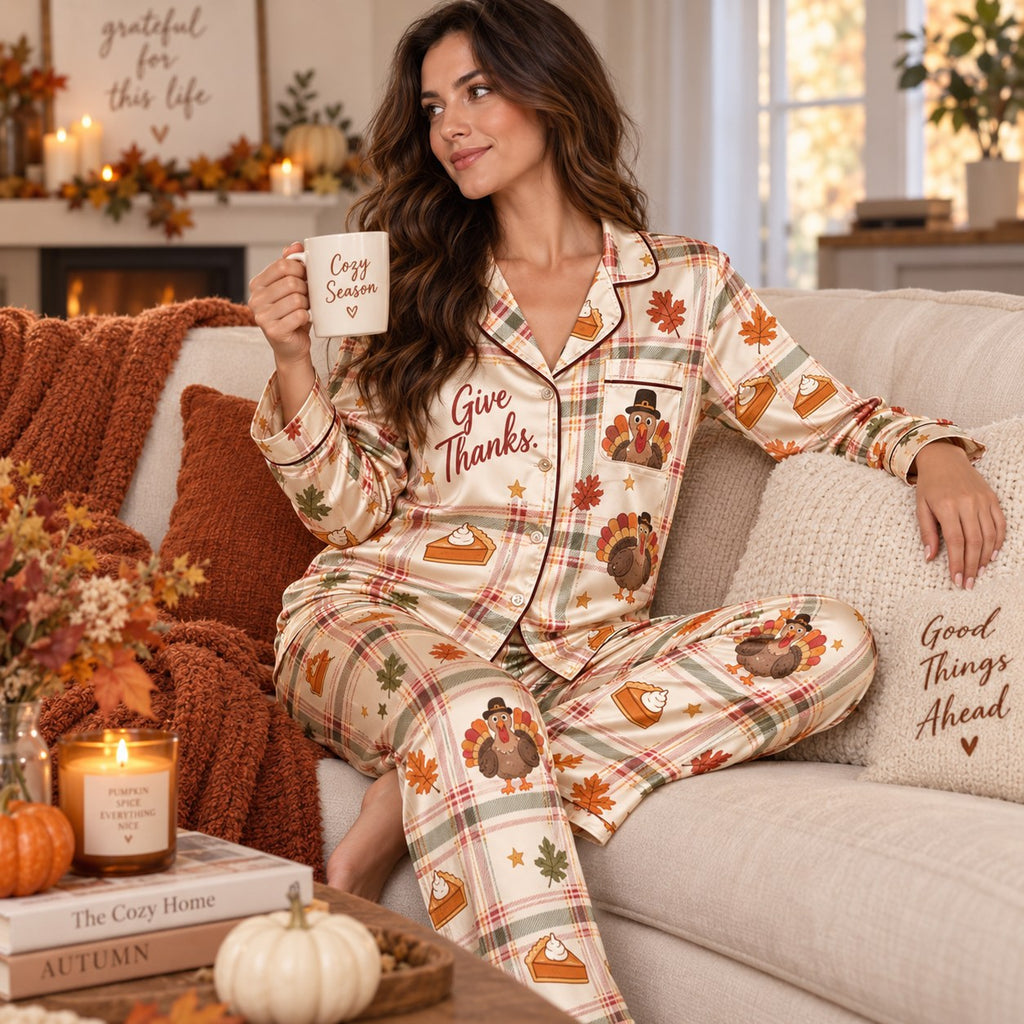 thanksgiving pajama set styled in autumn bedroom with mug and pumpkins