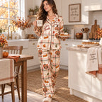 thanksgiving pyjamas in plaid print styled on couch with autumn leaves and