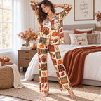 woman in thanksgiving satin pajamas sitting on couch holding pumpkin spice mug