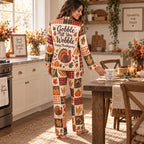 woman stretching in matching thanksgiving satin pajama set in cozy bedroom