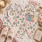 pastel harlequin skeleton satin pajamas flat lay with a custom name on the chest