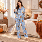 back view of pumpkin and ghost printed satin pajama set on model