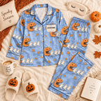 blue jack-o-lantern ghost satin pajamas flat lay with a custom name on the chest
