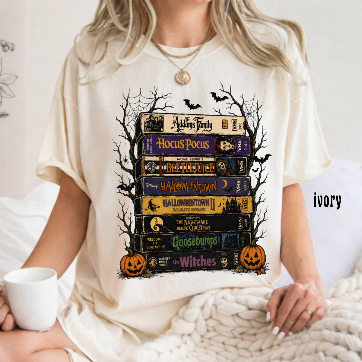 ivory cream tee with vintage halloween movie tape stack graphic