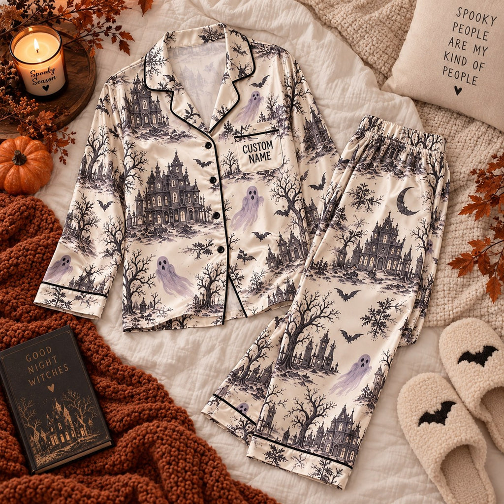 gothic haunted house satin pajamas flat lay with a custom name on the chest