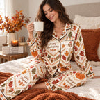 close up of happy thanksgiving satin pajamas model holding sweater weather coffee
