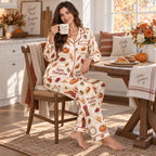 woman holding grateful today mug in autumn decorated bedroom wearing thanksgiving pyjamas